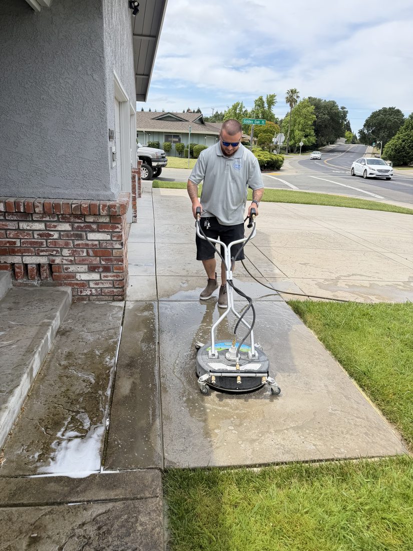 Pressure Pals team cleaning a driveway