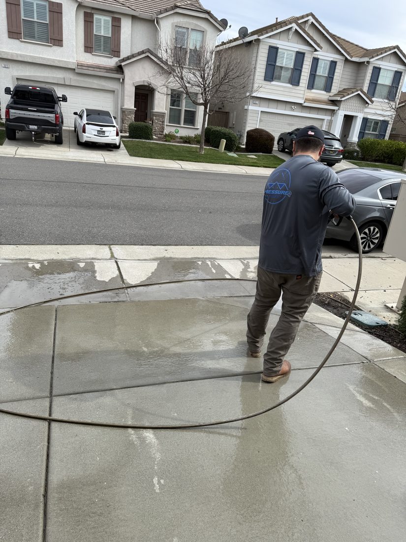 Pressure washing a driveway in Sacramento